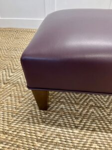 Delcor-bespoke-luxury-footstool-meticulously handcrafted in Britain-choose from over 10,000 fabrics-including velvets-leathers-vast array of patterned and plain materials-available in a broad spectrum of colours-including grey-cream-blue-purple-red-green-and more-each piece showcases timeless design and comfort.