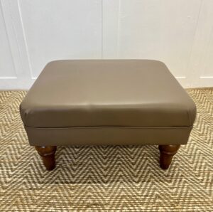 Delcor-bespoke-luxury-footstool-meticulously handcrafted in Britain-choose from over 10,000 fabrics-including velvets-leathers-vast array of patterned and plain materials-available in a broad spectrum of colours-including grey-cream-blue-purple-red-green-and more-each piece showcases timeless design and comfort.