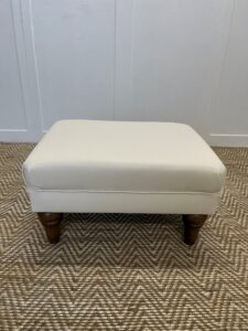 Embrace the luxury of choice and quality with Delcor’s bespoke footstools, beautifully crafted to complement any interior decor. Each footstool is made in Britain, featuring a selection from over 10,000 fabric options that span the finest velvets, rich leathers, and an extensive assortment of patterned and plain fabrics. The available colours cover a wide range—from classic neutrals to vibrant hues, ensuring every chair can be personalised to your taste. These footstools are not just pieces of furniture but statements of style and comfort, designed to elevate the aesthetic of any room while providing an inviting place to unwind.