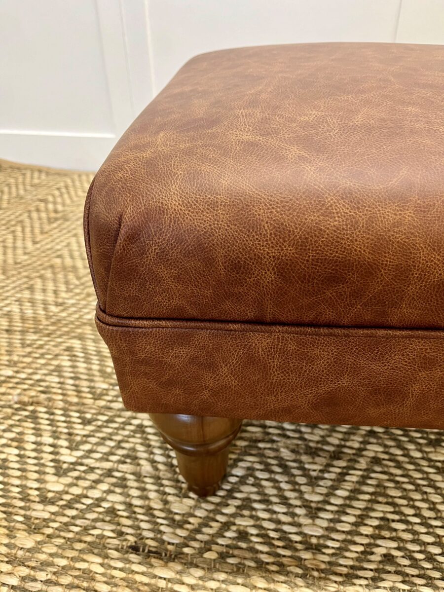 Delcor-bespoke-luxury-footstool-meticulously handcrafted in Britain-choose from over 10,000 fabrics-including velvets-leathers-vast array of patterned and plain materials-available in a broad spectrum of colours-including grey-cream-blue-purple-red-green-and more-each piece showcases timeless design and comfort.