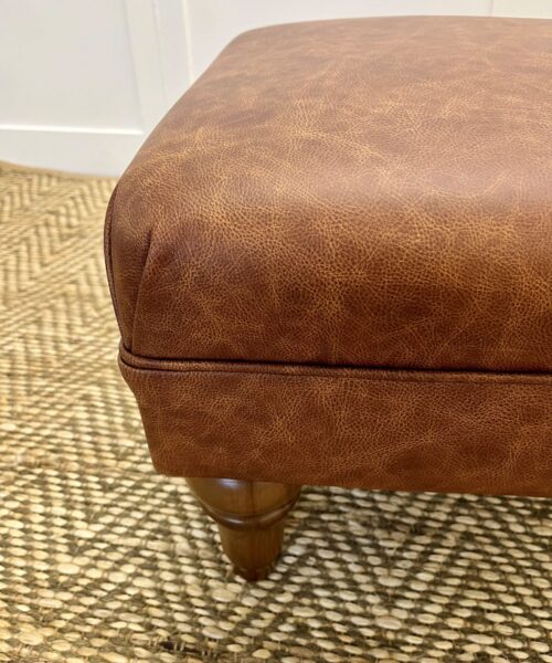 Delcor-bespoke-luxury-footstool-meticulously handcrafted in Britain-choose from over 10,000 fabrics-including velvets-leathers-vast array of patterned and plain materials-available in a broad spectrum of colours-including grey-cream-blue-purple-red-green-and more-each piece showcases timeless design and comfort.