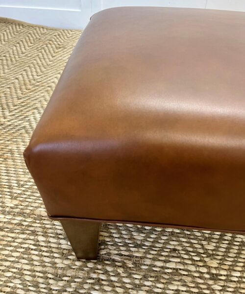 Delcor-bespoke-luxury-footstool-meticulously handcrafted in Britain-choose from over 10,000 fabrics-including velvets-leathers-vast array of patterned and plain materials-available in a broad spectrum of colours-including grey-cream-blue-purple-red-green-and more-each piece showcases timeless design and comfort.