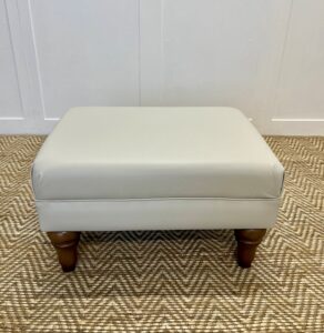 Delcor-bespoke-luxury-footstool-meticulously handcrafted in Britain-choose from over 10,000 fabrics-including velvets-leathers-vast array of patterned and plain materials-available in a broad spectrum of colours-including grey-cream-blue-purple-red-green-and more-each piece showcases timeless design and comfort.